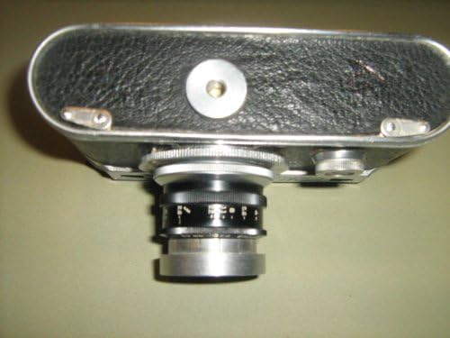 1940-1947 КОНДИД КОРАМАРСКИ КОРПЕРАЦИЈА НА ЧИКАГО ПЕРФЕКС Педесет и пет 35мм камера w/50mm F2.8 Wollensak Perflex Velostigmat леќи за завртки
